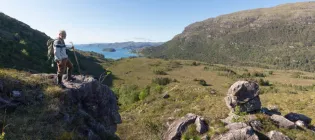 Richard Munday, Convenor of the Kinloch Woodlands SCIO, looking over land at Kinloch Woodlands in Shieldaig