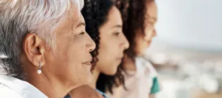 Side profile of Brazilian grandmother, mother and child, with neutral expressions