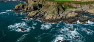 Aerial shot of coastal route on the North East of Scotland