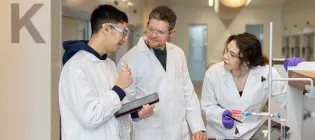 Researchers talking during an experiment.