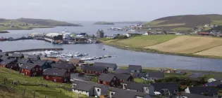 A cluster of houses next to water in Scalloway, Shetland Islands