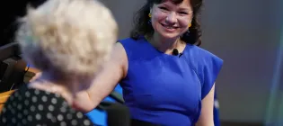 Olga Maksimova, founder of Lovat Compliance, speaks to colleague