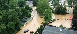 Aerial image of cars floating in flooded city streets