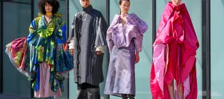 A group of young people model designs by final year students taking part in the Edinburgh College of Art Fashion Show 2025.