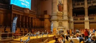 Colleagues looking towards the stage in McEwan Hall