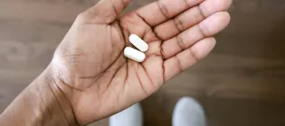 Hand holding tablets 