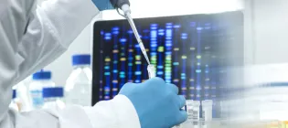 Scientist pipetting sample into a vial for DNA testing