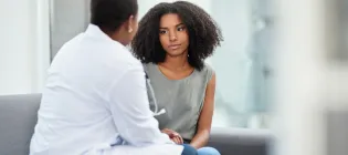 A young woman having a consultation with a doctor