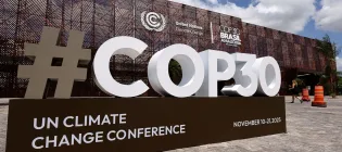 The COP30 logo is seen in front of the central building ahead of the COP30 Brazil Amazonia 2025 on November 3, 2025 in Belem, Brazil