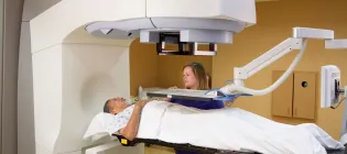 Elderly man receiving radiotherapy treatments for prostate cancer