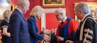 (L-R) Their Majesties The King and Queen present Professor Luke Bisby and Principal and Vice-Chancellor Professor Sir Peter Mathieson with the Queen Elizabeth Prize for Education award during a ceremony at at St James’s Palace on Tuesday 24 February.