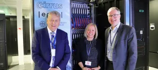 Professor Sir Peter Mathieson, Lynn McMath and Professor Mark Parsons in front of the Cirrus supercomputer