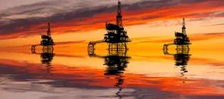 Offshore oil rigs at sunset 