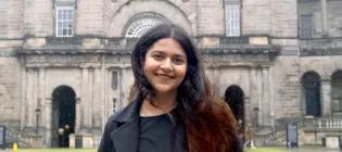 Narayani standing in Old College Quad