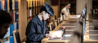 student studying in a library
