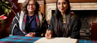 Kelisha Pandaram receiving her Principal’s Medal from Professor Kim Graham in 2025