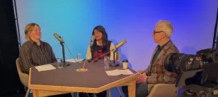 (L-R) Ash Scholz, Syjil Ramjuthan and Matthias Schwannauer sit around a table set up with microphones for a vodcast discussion