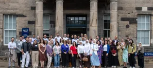 Attendees of the HESPAL annual gathering assembled outside the ECCI building. 