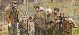 George McPhee and family with sticks for a bow tent, c 1910