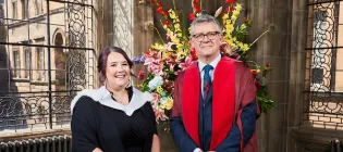 Being Edinburgh award winner Sabrina Tickle (L) standing with Chris Cox, Vice-Principal Philanthropy and Advancement (R) during a 2026 summer graduation ceremony at the University of Edinburgh