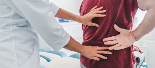 Close up of doctor examining patient's back