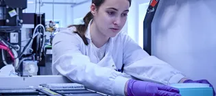 A member of staff at the Edinburgh Genome Foundry.