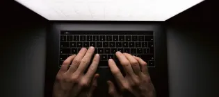 Person using a laptop. Credit- GettyImages