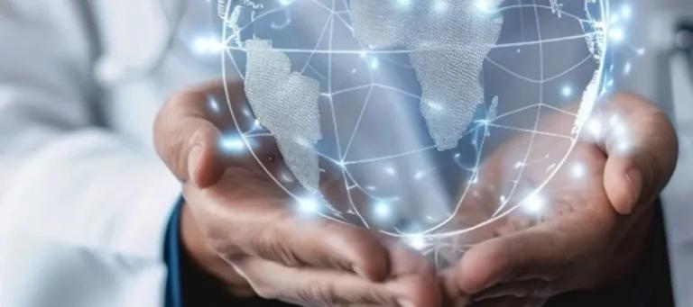 person holding a computer generated globe in their hand