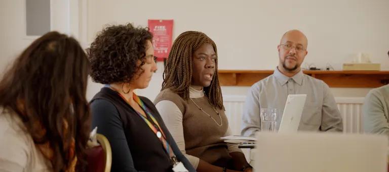 Four members of the University community sit in an engagement session as part of the Race Review