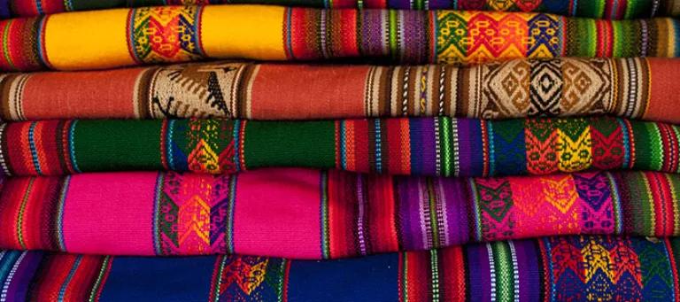 Brightly coloured material in a stack 