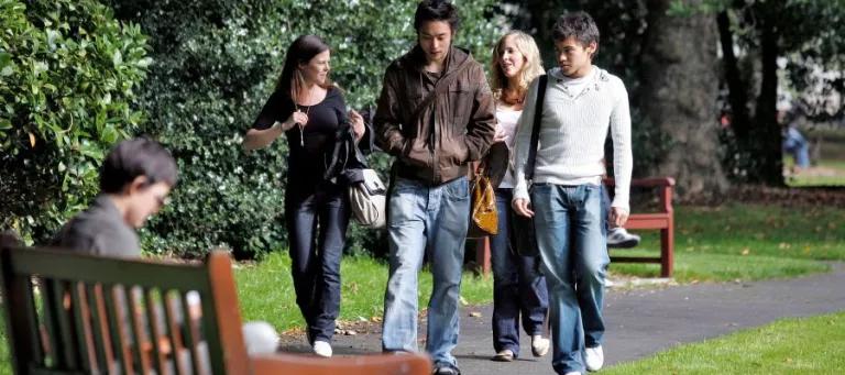 Students taking a walk in George Square gardens, Central Area campus.