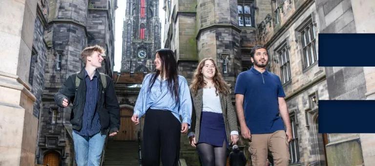 Four students walking at New College.