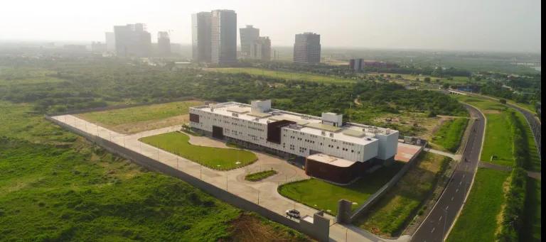 Aerial view of GBU, showing a city skyline with high skyscrapers in the background
