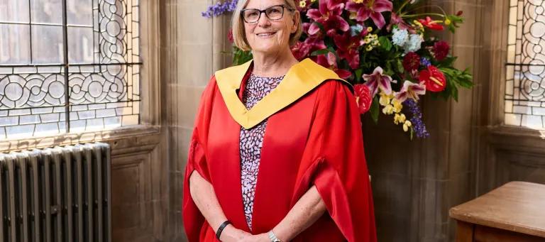 Dr Kathy Sullivan standing in graduation robes at McEwan Hall, 2026