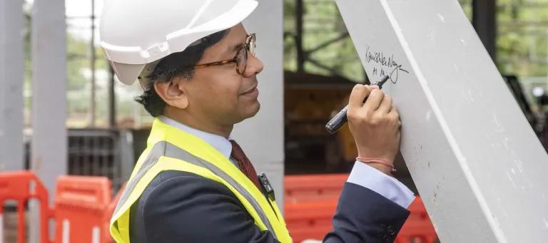Minister Narayan signs steel beam