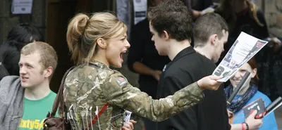 Girl handing out hype magazine