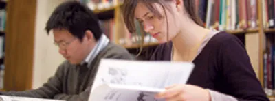 students reading in library