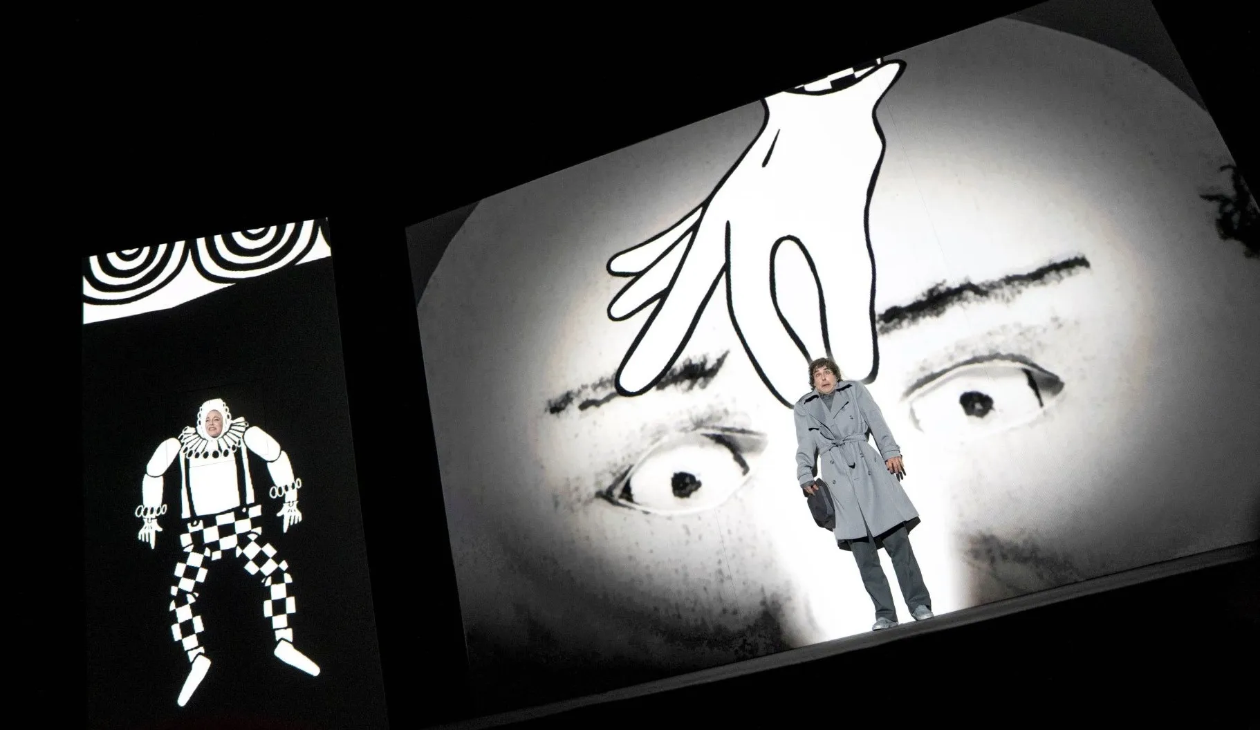 Two figures on stage in an animated theatre production