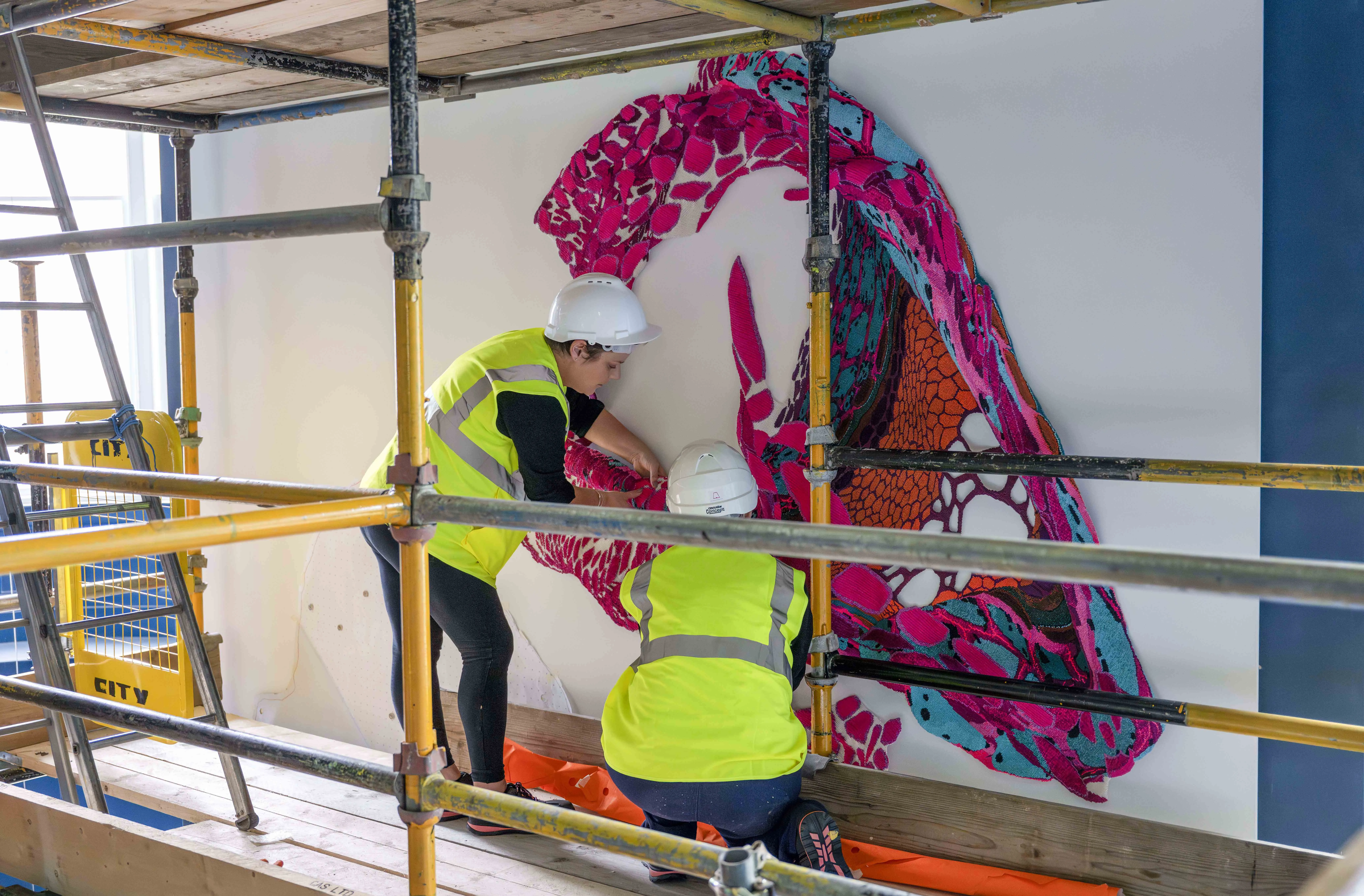 Dovecot Studio weavers Naomi Robertson & Louise Trotter install the Edinburgh Seven Tapestry at the new Edinburgh Futures Institute