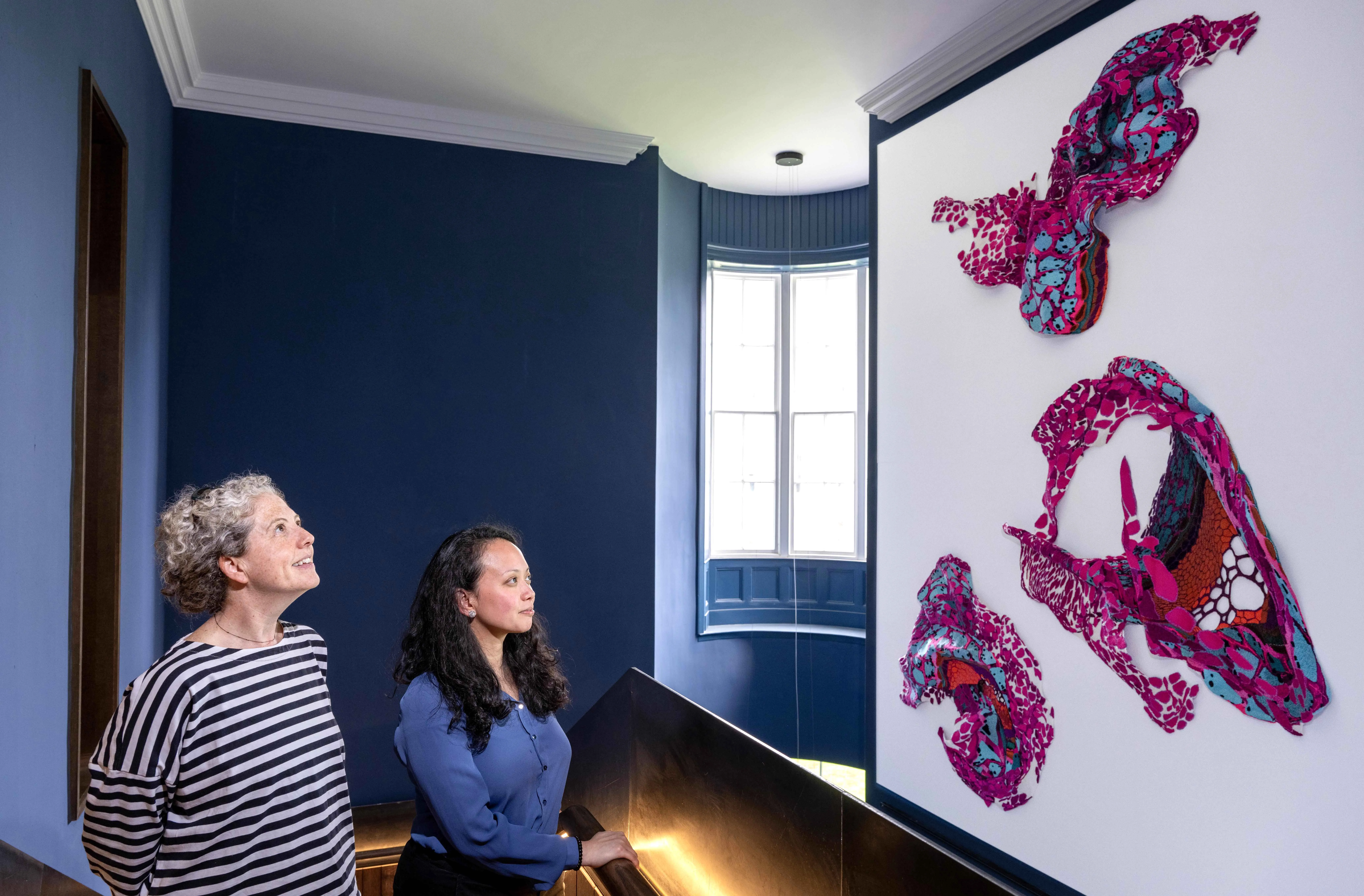 Edinburgh Futures Institute colleagues Siobhan Dunn & Katrina Macapagal admire the Edinburgh Seven Tapestry