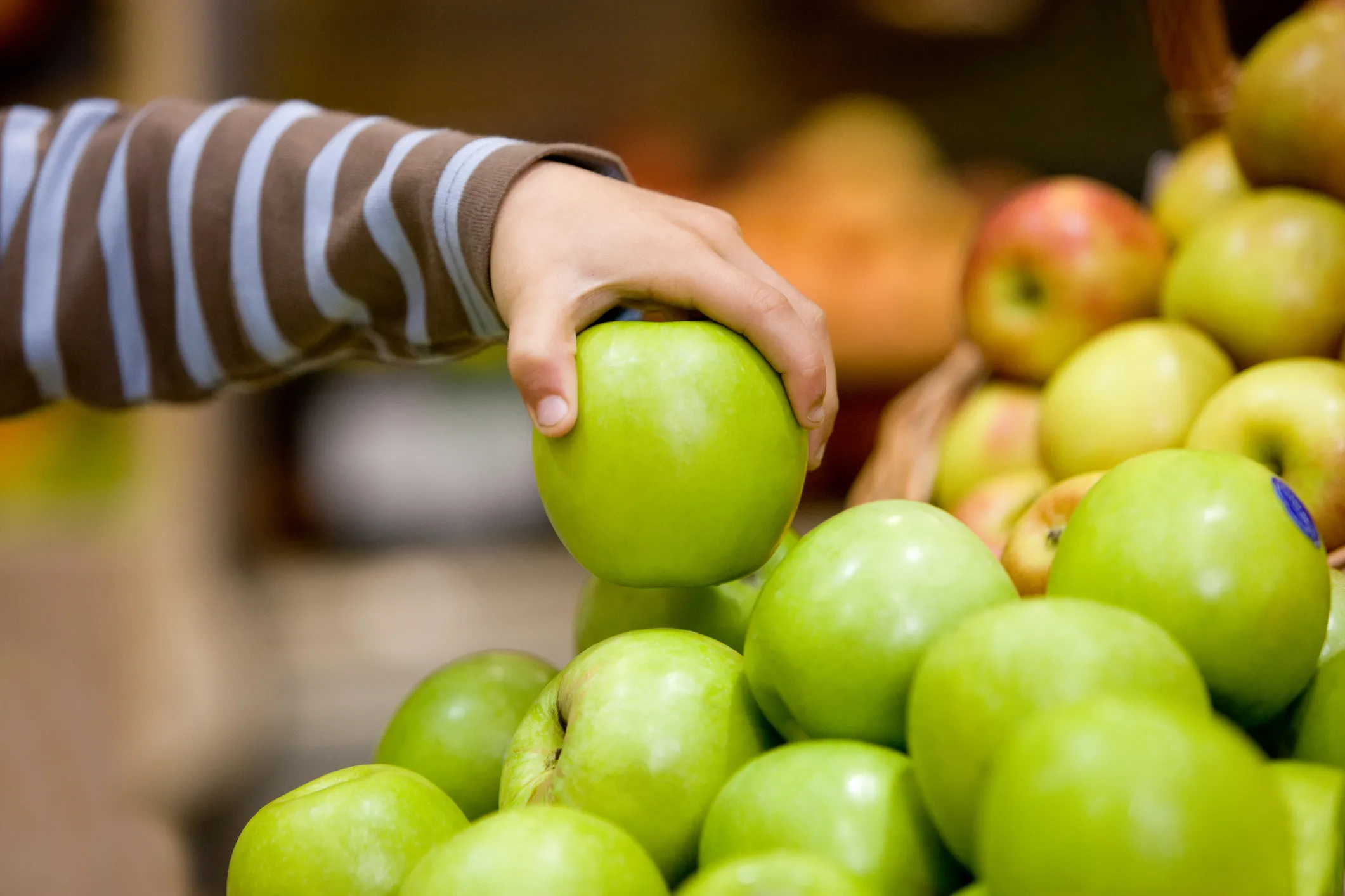 Child's hand and apples