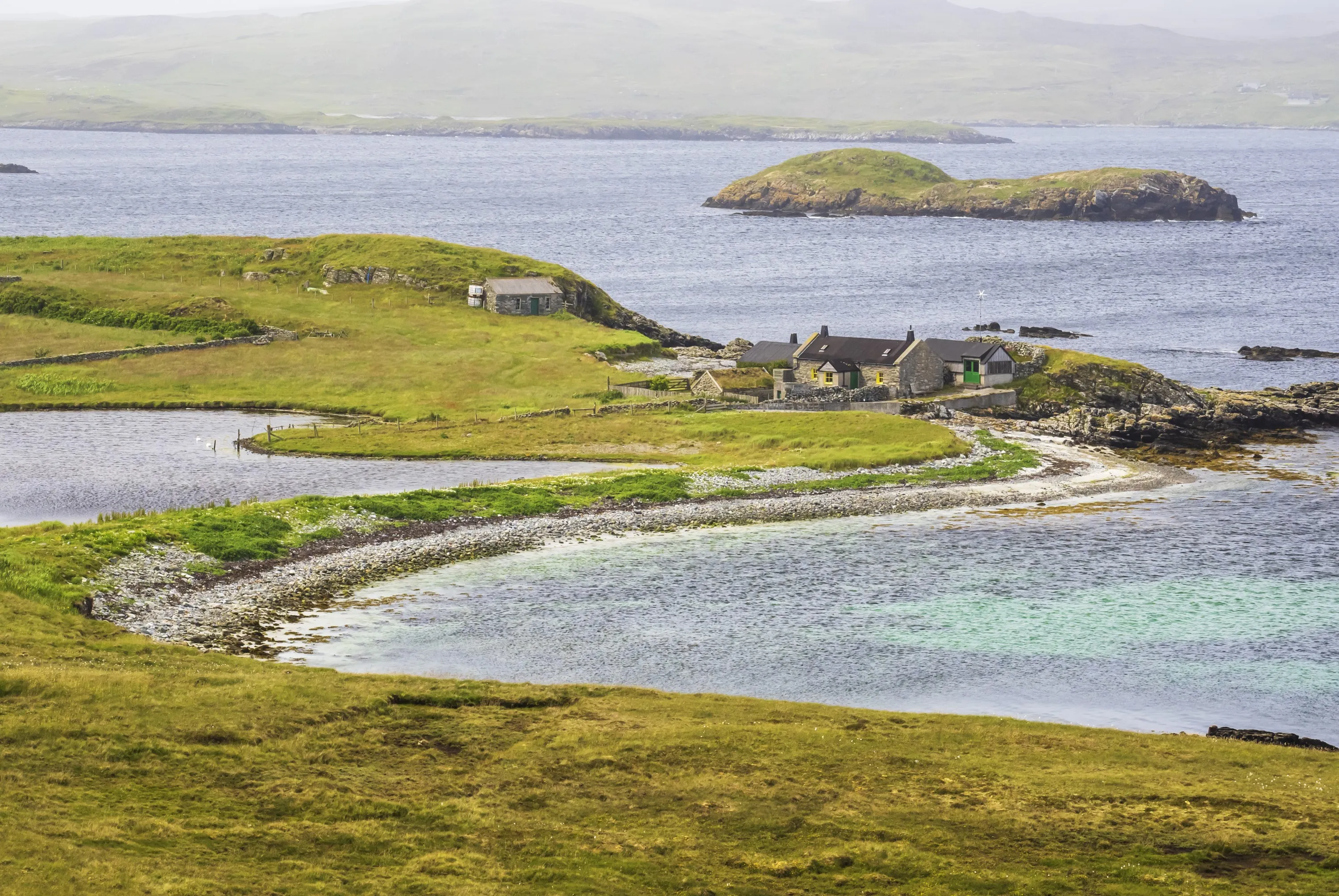 A croft house on the coast at Ling Ness, South Nesting, Shetland, Scotland, UK