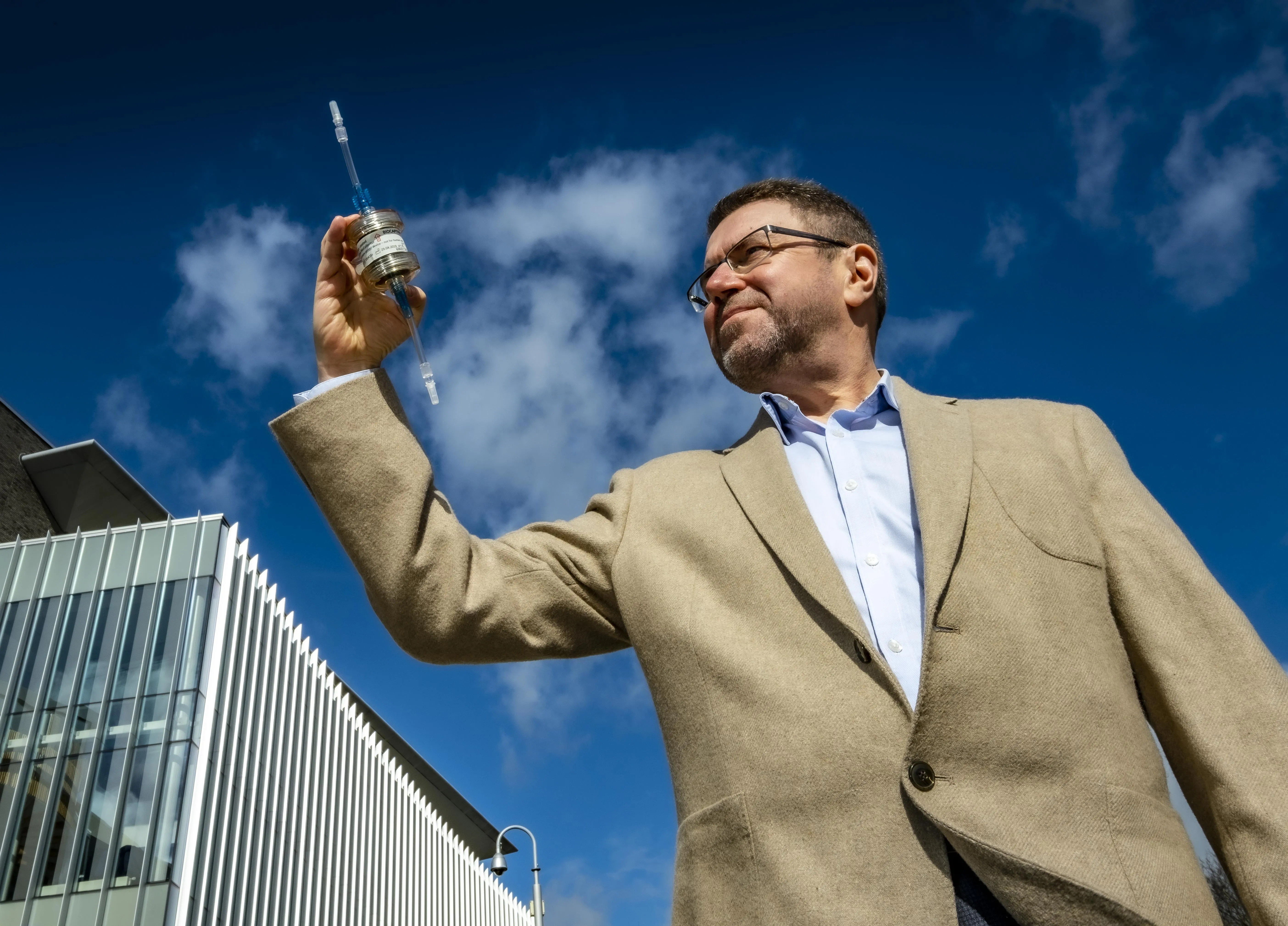BioCaptiva CEO Jeremy Wheeler with a prototype of the BioCollector device.