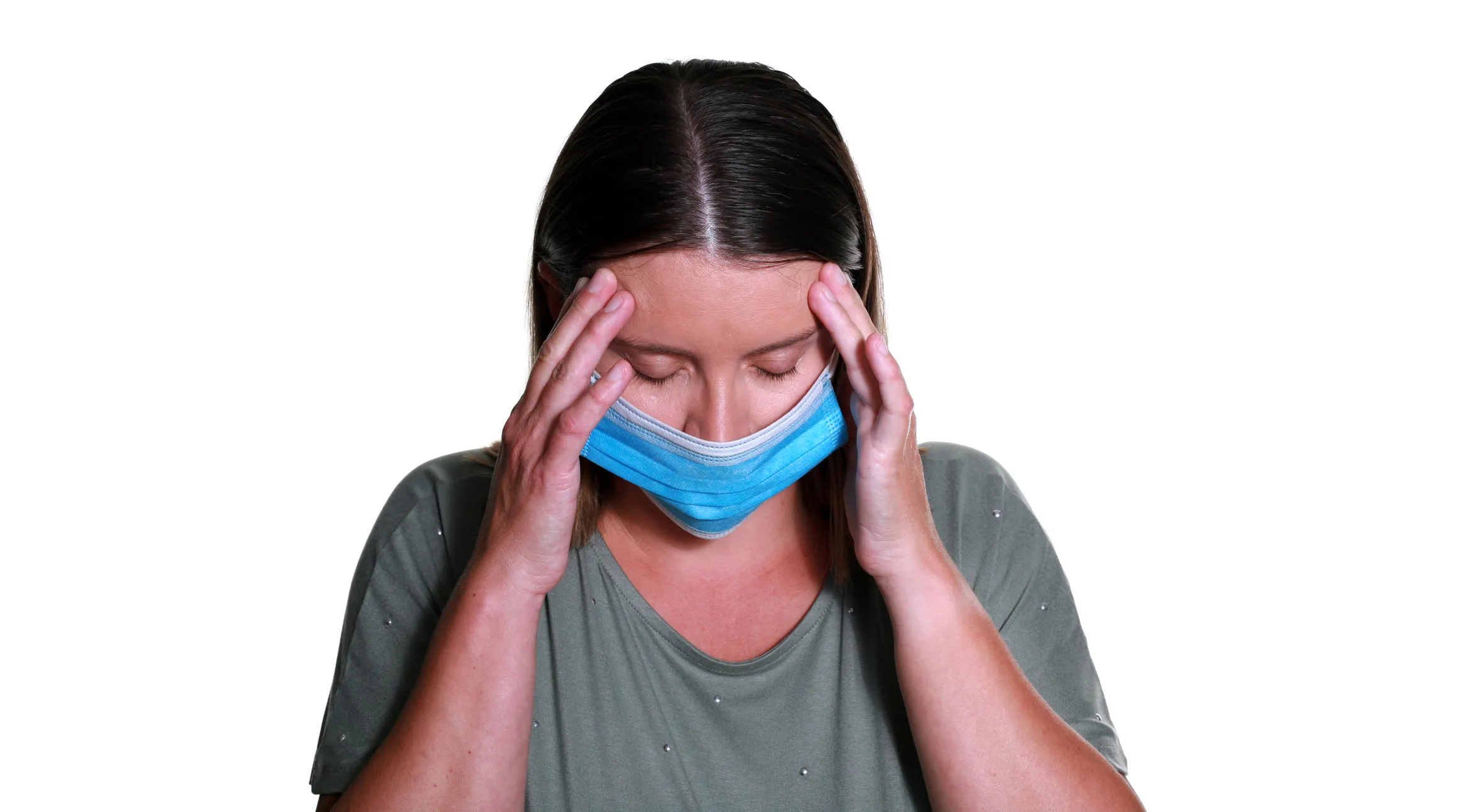 Woman with a headache grasping her head