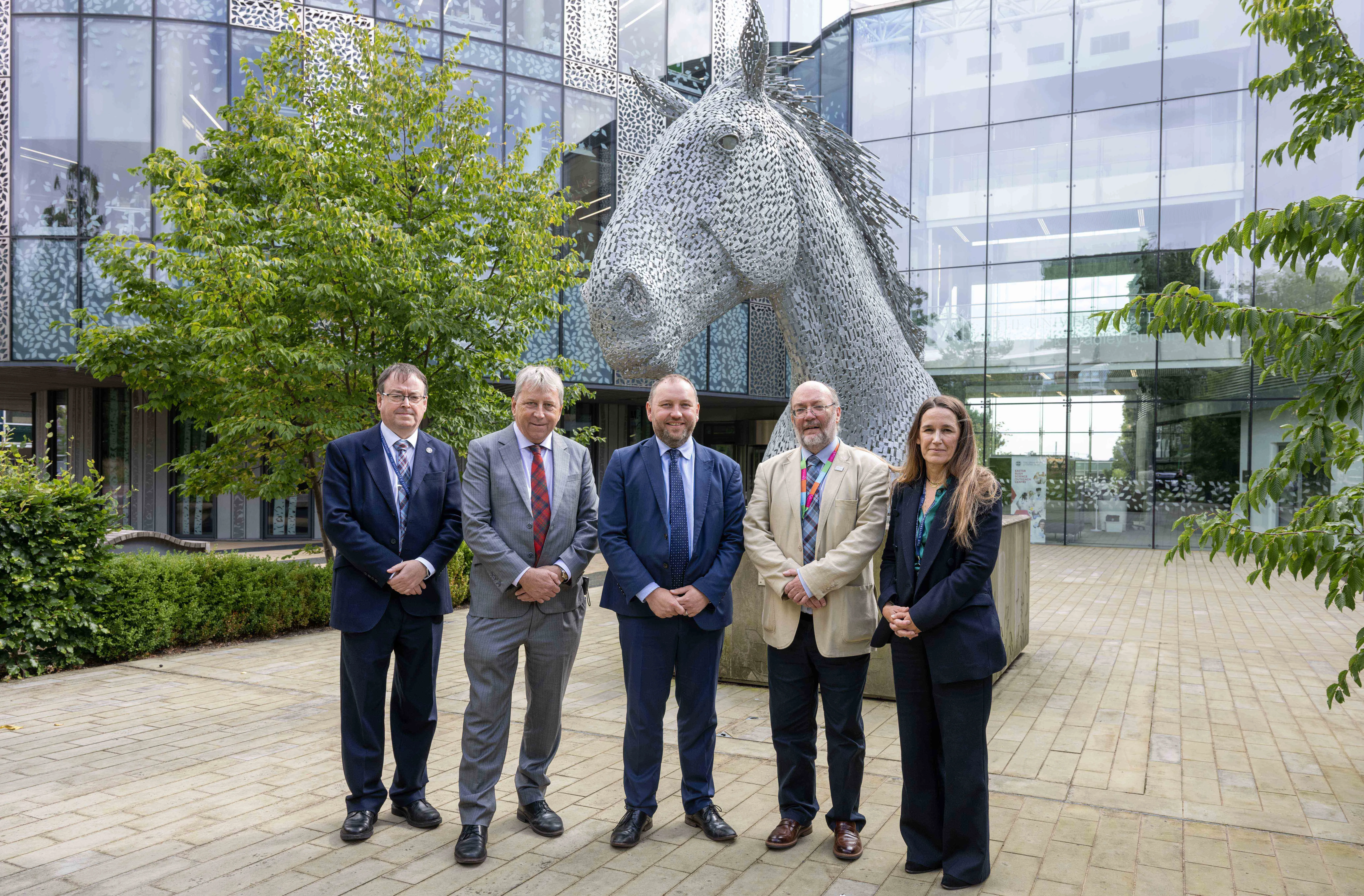 David Argyle, Principal, Ian Murray, Bruce Whitelaw and Lisa Boden in front of the Kelpie at Easter Bush