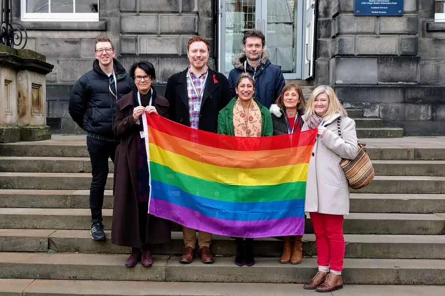 Image of staff wearing rainbow lanyards