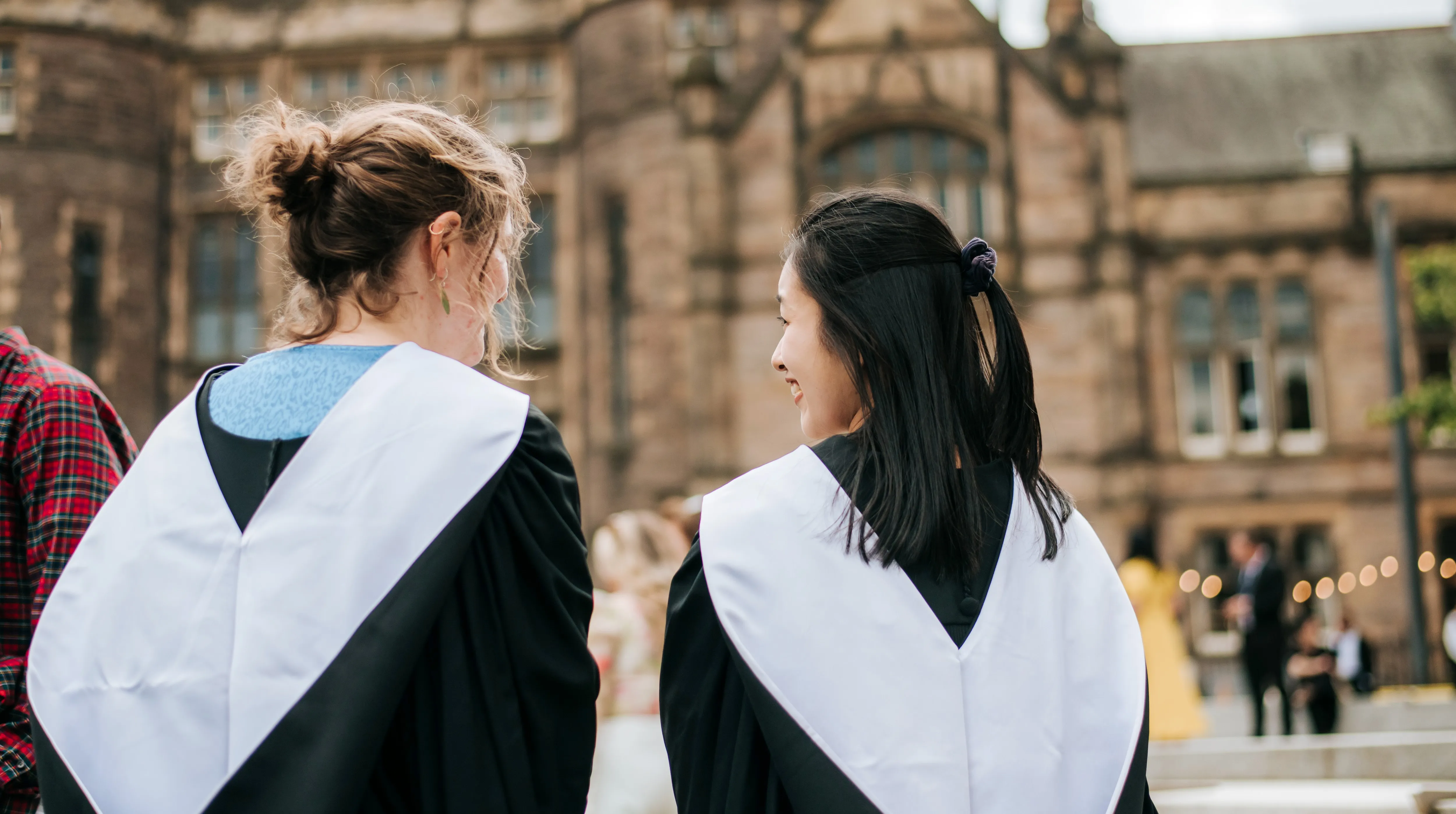 Image of two graduating students at Bristo Square
