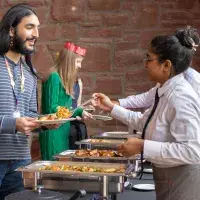 A student is served from the buffet at the University of Edinburgh Festive Lunch