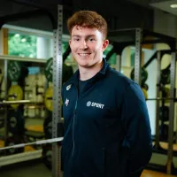 Swimmer Archie Goodburn poses in the University gym