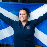 Weightlifter Maddie Rocher poses with a Saltire flag. 